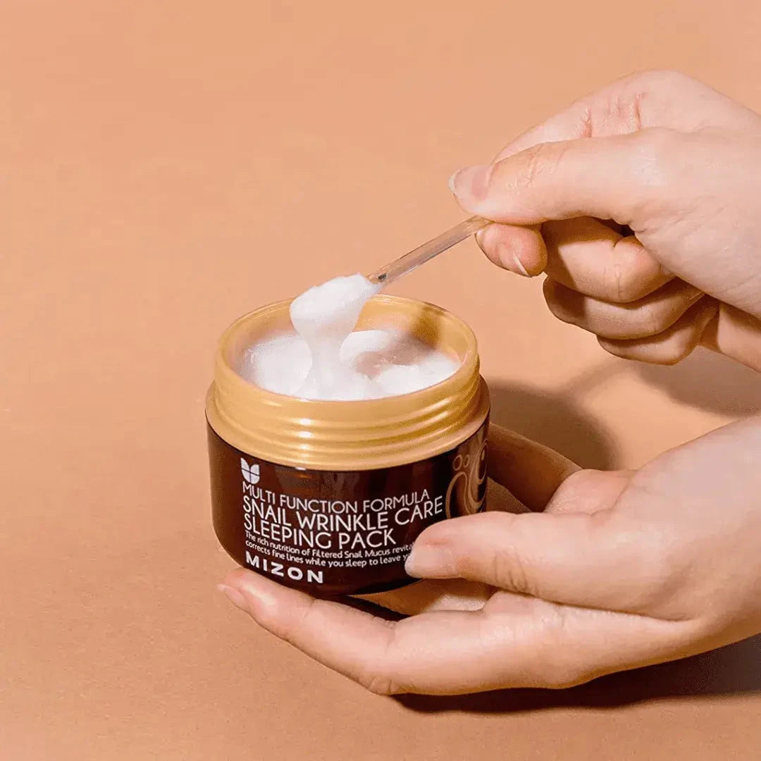 Nakts pretnovecošanās maska ar gliemežu ekstraktu Mizon Snail Wrinkle Care Sleeping Pack